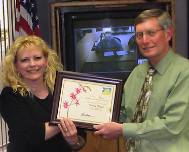 Tammy receiving her award from Ron Enger